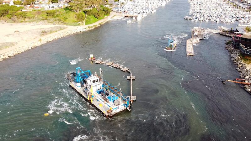 A boat dragged to the harbour mouth by the tidal surge in Santa Cruz, California, US. Reuters