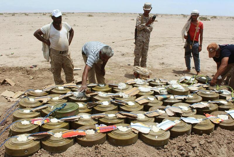 Yemeni security forces assemble land mines and explosives seized from Al Qaeda before destroying them in the desert of Al Alam, east of Aden, on Apil 29, 2016. Saleh Al Obeidi / AFP