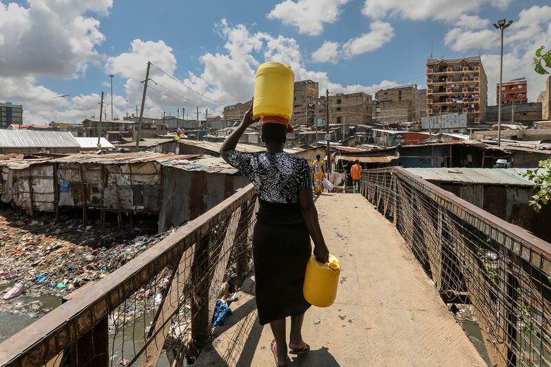 Fetching water in the Mathare slums of Nairobi, Kenya. Middlemen exploit shortages to sell water at exorbitant prices. PA