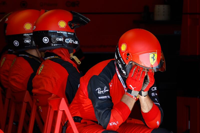 Ferrari mechanics react after  Leclerc's crash. AP