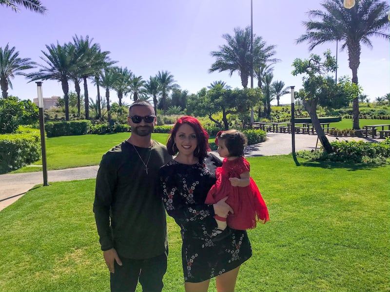 Abu Dhabi residents Emily and Nader Musharbash with their daughter Tia. The couple have saved Dh6,000 a month by cutting their expenditure. Courtesy Emily Musharbash