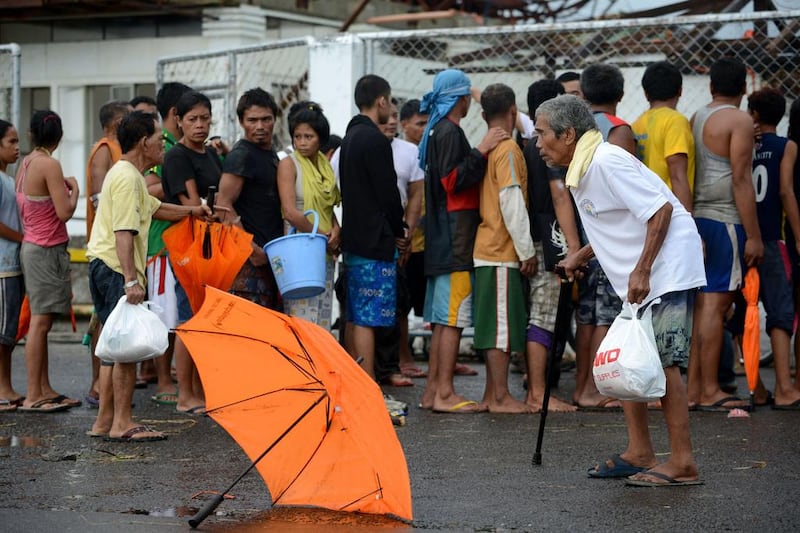 Typhoon victims queue up for relief goods in Tacloban, on the eastern island of Leyte.

AFP PHOTO / NOEL CELIS

