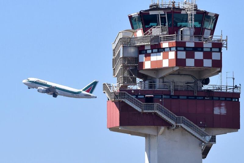 Ten long-haul routes will be introduced as part of Alitalia's five-year plan. Above, an Alitalia aircraft takes off from the Leonardo da Vinci Fiumicino airport, near Rome. Alberto Lingria / AFP