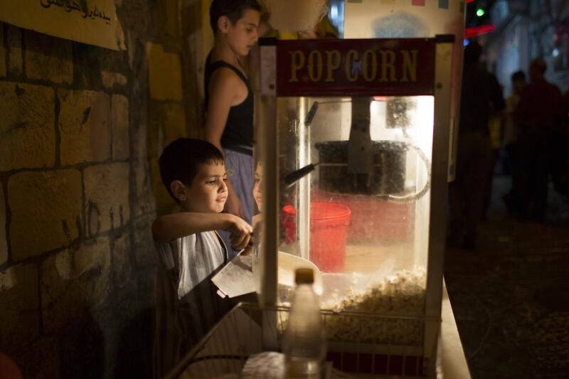 Children manning a popcorn stall in the old market.