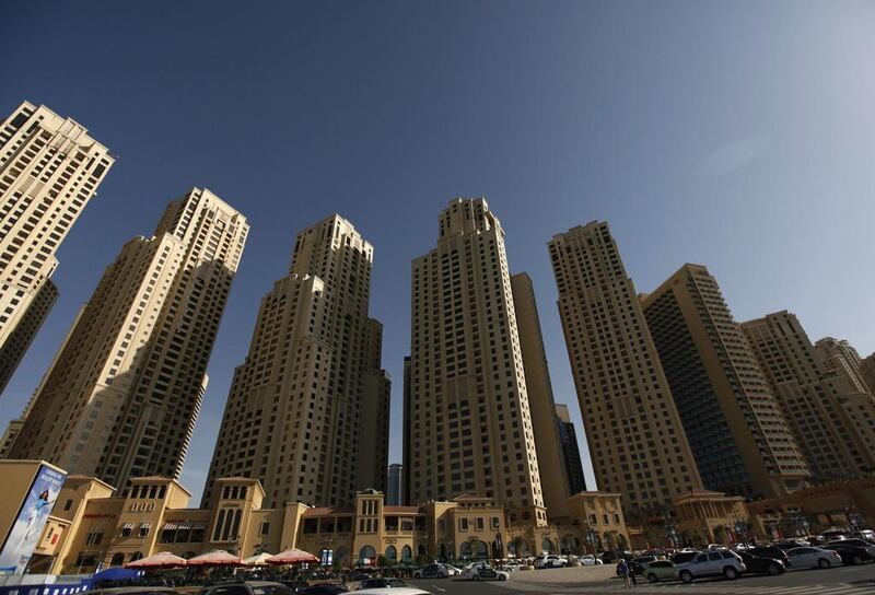 Mario Volpi helps a Jumeirah Beach Residence landlord with a problem concerning damaged walls. Jumana El Heloueh / Reuters