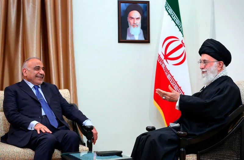 In this picture released by an official website of the office of the Iranian supreme leader, Supreme Leader Ayatollah Ali Khamenei, right, speaks with Iraqi Prime Minister Adel Abdel Mahdi, in Tehran, Iran, Saturday, April, 6, 2019. (Office of the Iranian Supreme Leader via AP)