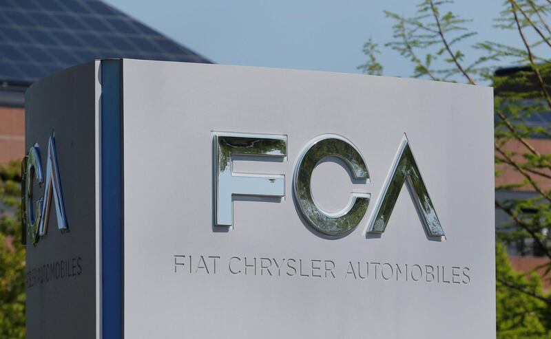 FILE PHOTO: A Fiat Chrysler Automobiles (FCA) sign is seen at its U.S. headquarters in Auburn Hills, Michigan, U.S. May 25, 2018.  REUTERS/Rebecca Cook/File Photo  GLOBAL BUSINESS WEEK AHEAD