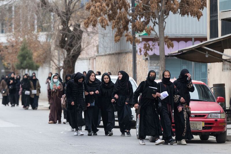 Schoolgirls return home after sitting their high school graduation exams in Kabul. AFP