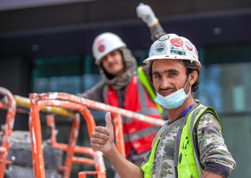 Abu Dhabi, United Arab Emirates, January 13, 2021.   Sneak peek of Al Qana Abu Dhabi and  interview with Fouad Mashal, CEO of Al Barakah International Investment and owner of Al Qana.  Workers are all thumbs up at the jobsite.
Victor Besa/The National
Section:  NA
Reporte:  Haneen Dajani