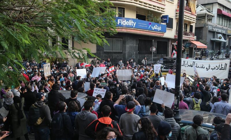 Students from different universities carry placards, wave Lebanese flags during a demonstration under the slogan of 'A Day of Student Rage' in Al-Hamra, Beirut. EPA