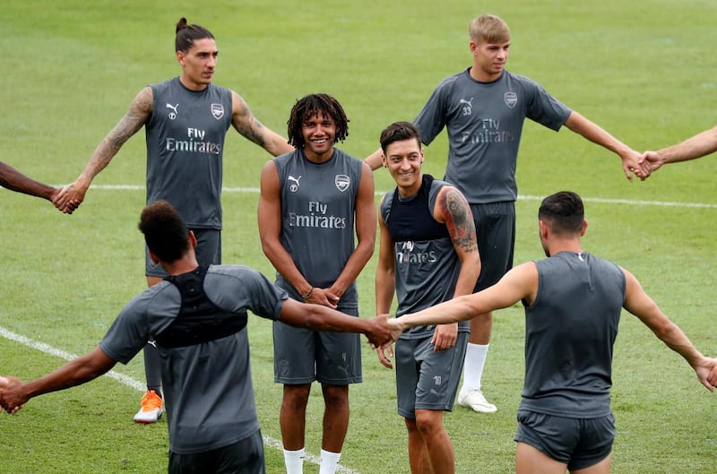 Ozil, centre right, attends the training session. Reuters
