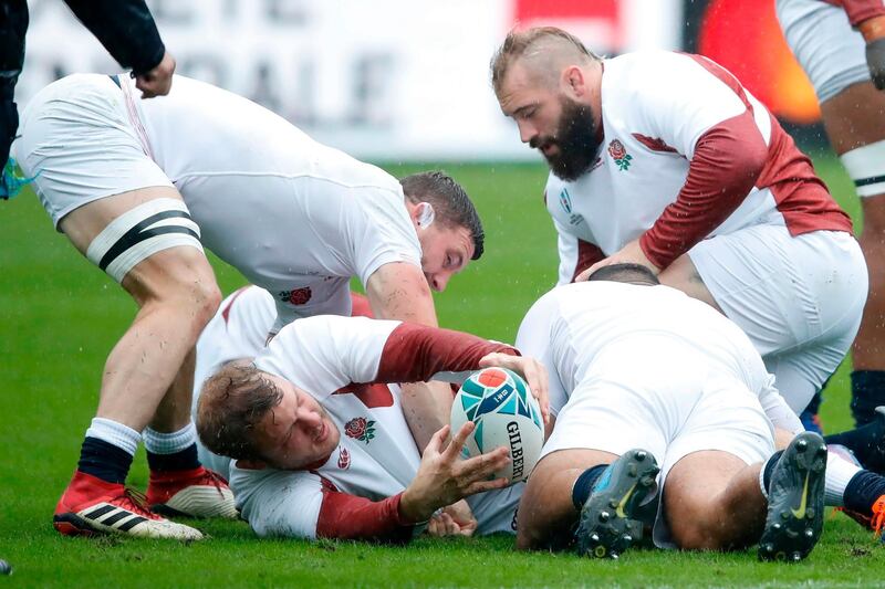 England's lock Joe Launchbury is tackled during a training session. AFP