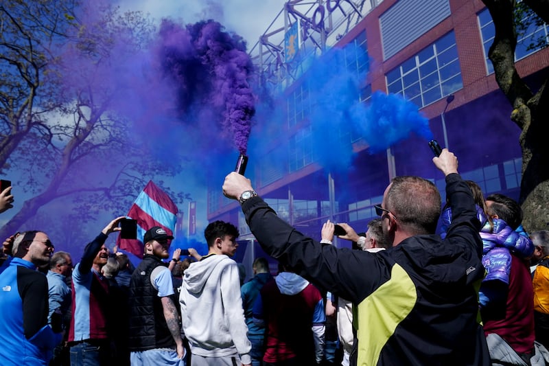 Aston Villa fans let off smoke flares as the team bus arrives before a Premier League match at Villa Park, Birmingham, against Bournemouth, which the home team won 3-1. PA
