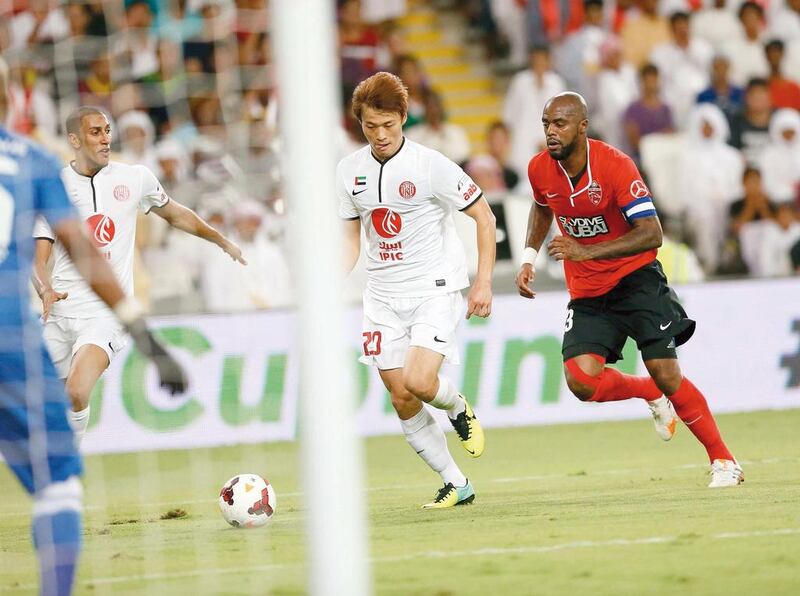 Al Ahli striker Grafite, right, pictured during the Arabian Gulf Cup final against Al Jaizra on April 19, 2014, scored the equaliser for his side against Ajman in the Arabian Gulf League on May 2, 2014. Al Ittihad