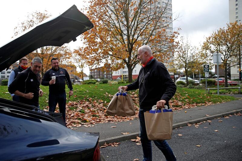 Volunteers from Richmond Rugby prepare to deliver meals to local school children on the Ivybridge estate in Twickenham, south west London. AFP