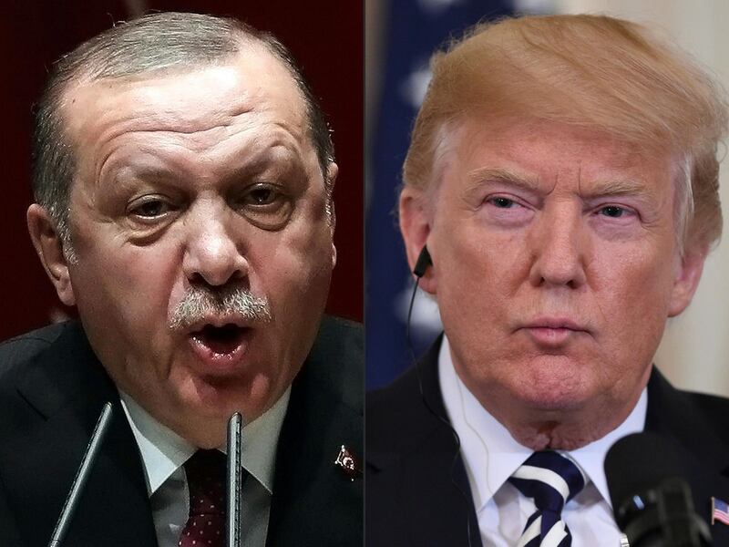 (COMBO) This combination of file pictures created on August 11, 2018 shows Turkish President Recep Tayyip Erdogan (L) deliverling a speech during an AK party's group meeting at the AK Party's headquarters in Ankara, on January 26, 2018; and  US President Donald Trump (R) during a joint press conference with Italian Prime Minister Giuseppe Conte in the East Room of the White House in Washington, DC, July 30, 2018.
 US President Donald Trump warned Turkey on Sunday, January 13, 2019 of economic devastation if it attacks Kurdish forces in the wake of the US troop pullout from Syria, while also urging the Kurds not to "provoke" Ankara. "Will devastate Turkey economically if they hit Kurds," Trump tweeted, while pushing for the creation of a 20-mile (30-kilometer) safe zone.

 / AFP / ADEM ALTAN AND SAUL LOEB
