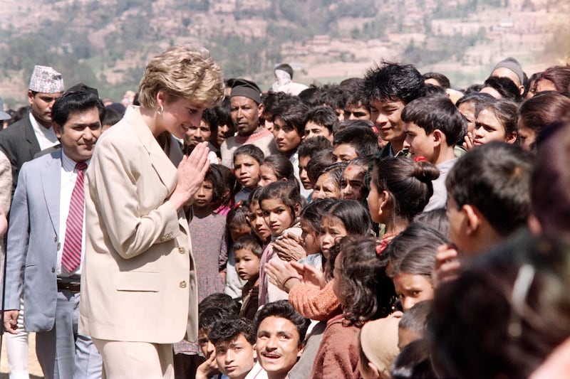 Princess Diana speaks to Nepali children while touring a Red Cross project in the Himalayan foothills in 1993. AFP