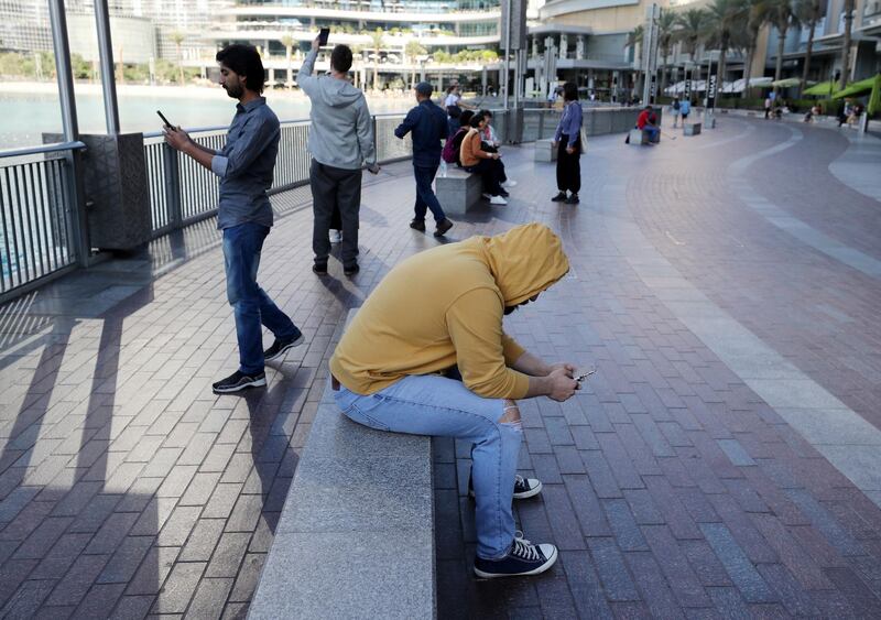 Dubai, United Arab Emirates - Reporter: N/A: People wrap up warm on a cold day in Dubai. Sunday, December 22nd, 2019. Dubai. Chris Whiteoak / The National