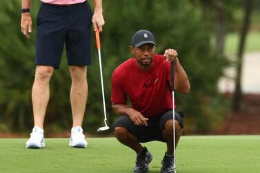 Tiger Woods and Peyton Manning during The Match: Champions for Charity golf round at the Medalist Golf Club. Getty