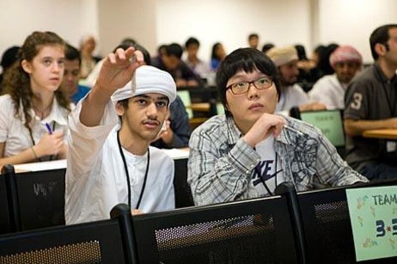 Ghalib Al Hanai and Ho Jung Kim, 18, from Emirates National School, put their heads together.