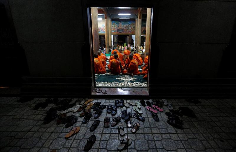 Buddhist monks sit at a pagoda during the first day of the Pchum Ben festival in Phnom Penh. Samrang Pring / Reuters