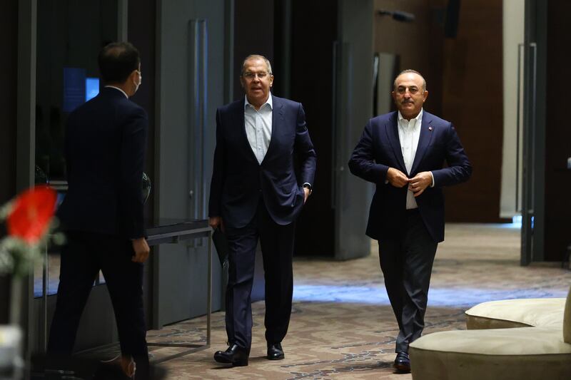 A handout photo made available by Russian Foreign Ministry shows Russian Foreign Minister Sergey Lavrov (C) and Turkish Foreign Minister Mevlut Cavusoglu (R) during their meeting in Antalya, Turkey. EPA