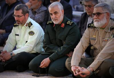 (FILES) In this file handout picture provided by the office of the Iranian Ayatollah Ali Khamenei on June 4, 2019 shows Iranian Major General in the Islamic Revolutionary Guard Corps (IRGC) Qasem Soleimani (C) listening to the Iranian supreme leader as delivers a speech on the occasion of the 30th death anniversary of the founder of the Islamic republic Ayatollah Ruhollah Khomeini, at his shrine in Tehran. One year after US forces assassinated Iran's top commander in Baghdad, tensions are boiling between Iraq's Washington-backed premier and pro-Tehran forces that accuse him of complicity in the drone strike. US President Donald Trump sent shock waves through the region with the January 3, 2020 targeted killing of Iran's revered General Qasem Soleimani and his Iraqi lieutenant, which infuriated the Islamic republic and its allies. -  === RESTRICTED TO EDITORIAL USE - MANDATORY CREDIT "AFP PHOTO / HO / KHAMENEI.IR" - NO MARKETING NO ADVERTISING CAMPAIGNS - DISTRIBUTED AS A SERVICE TO CLIENTS ===
 
 / AFP / IRANIAN SUPREME LEADER'S WEBSITE / HO /  === RESTRICTED TO EDITORIAL USE - MANDATORY CREDIT "AFP PHOTO / HO / KHAMENEI.IR" - NO MARKETING NO ADVERTISING CAMPAIGNS - DISTRIBUTED AS A SERVICE TO CLIENTS ===
 
