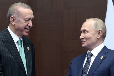 Turkish President Recep Tayyip Erdogan (L) meets Russian President Vladimir Putin on the sidelines of the Conference on Interaction and Confidence Building Measures in Asia (CICA) in Astana, on October 13, 2022.  (Photo by Handout  /  TURKISH PRESIDENTIAL PRESS SERVICE  /  AFP)  /  RESTRICTED TO EDITORIAL USE - MANDATORY CREDIT "AFP PHOTO  /  HO -  TURKISH PRESIDENTIAL PRESS SERVICE" - NO MARKETING NO ADVERTISING CAMPAIGNS - DISTRIBUTED AS A SERVICE TO CLIENTS