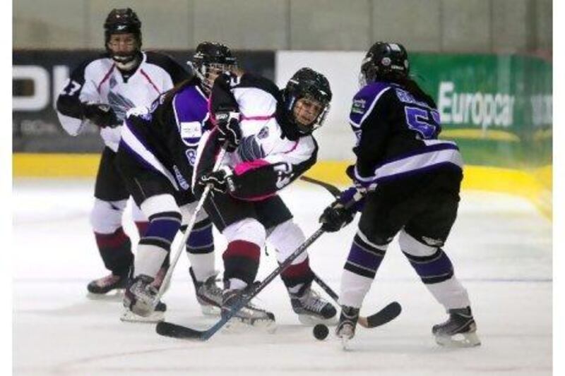 Dubai Cameluscious, in purple, lost 5-4 to their younger rivals, Abu Dhabi Storms, in the first official women's game. Silvia Razgova / The National