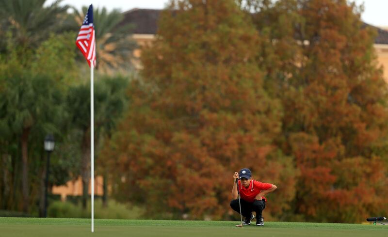 Charlie Woods line up a putt on the 18th hole during the final round of the PNC Championship at the Ritz Carlton Golf Club. AFP
