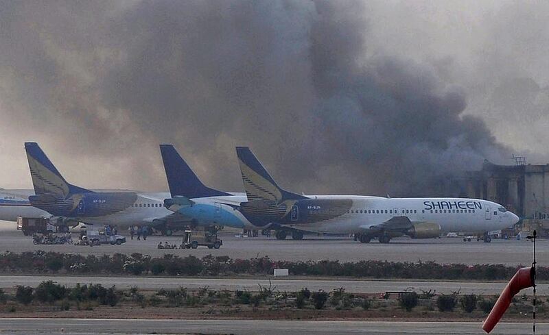 Smoke rises hours after militants launched an assault at Jinnah International Airport in Karachi late on Sunday. The Tehrik-e-Taliban Pakistan have claimed responsibility for the attack. Rizwan Tabassum / AFP Photo