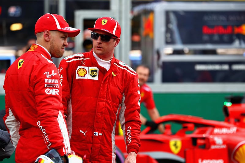 MELBOURNE, AUSTRALIA - MARCH 24:  Kimi Raikkonen of Finland and Ferrari and Sebastian Vettel of Germany and Ferrari talk in parc ferme after qualifying for the Australian Formula One Grand Prix at Albert Park on March 24, 2018 in Melbourne, Australia.  (Photo by Mark Thompson/Getty Images)