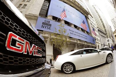 (FILES) This file photo taken on November 18, 2010, shows GM cars outside the New York Stock Exchange in New York.   General Motors said on July 24, 2018, it was launching a peer-to-peer car rental service to allow owners to make money by listing them as shared vehicles. The US auto giant said GM car owners would be able to list their vehicles via Maven, its car-sharing service in which the company offers hourly or daily rentals.
 / AFP / Timothy A. CLARY
