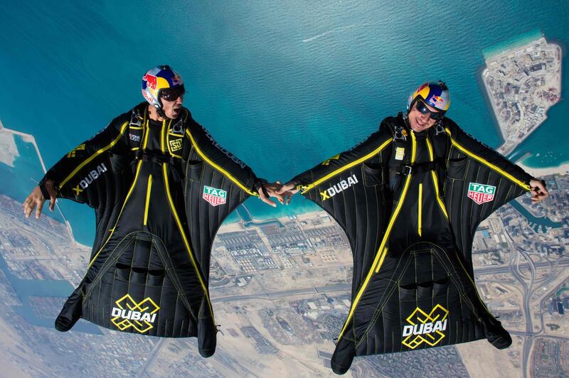 Wing-suit pilots Fred Fugen (R) and Vince Reffet fly over Dubai's Palm Islands in March 2017. Max Haim / AFP