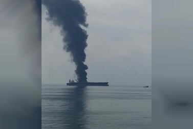 Plumes of smoke rise from the Panamanian tanker about 30km off the UAE coast on Wednesday. The crew was rescued safely and early reports suggest it was 'an accident during maintenance operations', officials said. Courtesy: Wam