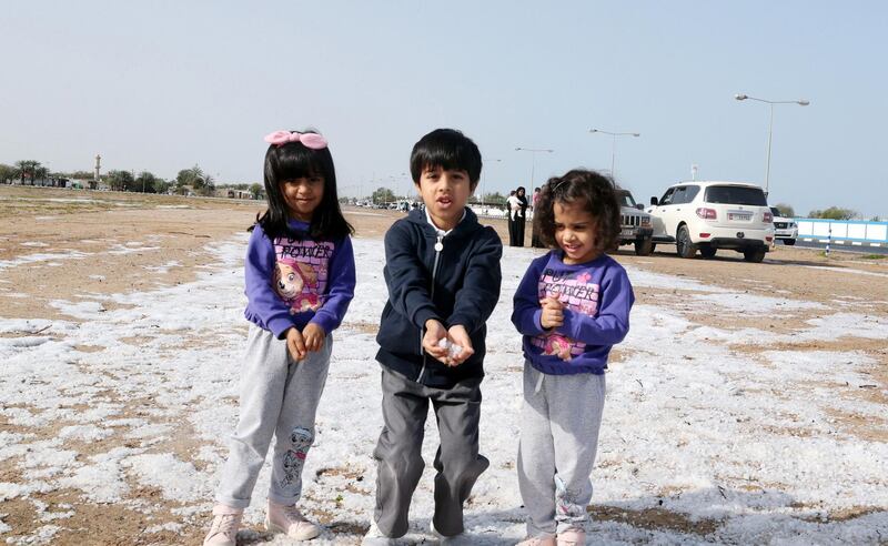 Children play in the hail in Umm Al Quwain. Such conditions are rare but not unheard of in northern areas. Wam