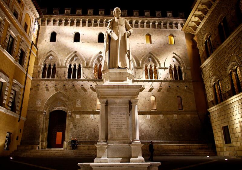 FILE PHOTO: The entrance of Monte dei Paschi bank headquarters is seen in downtown Siena, Italy, October 27, 2017. Picture taken October 27, 2017. REUTERS/Stefano Rellandini/File Photo