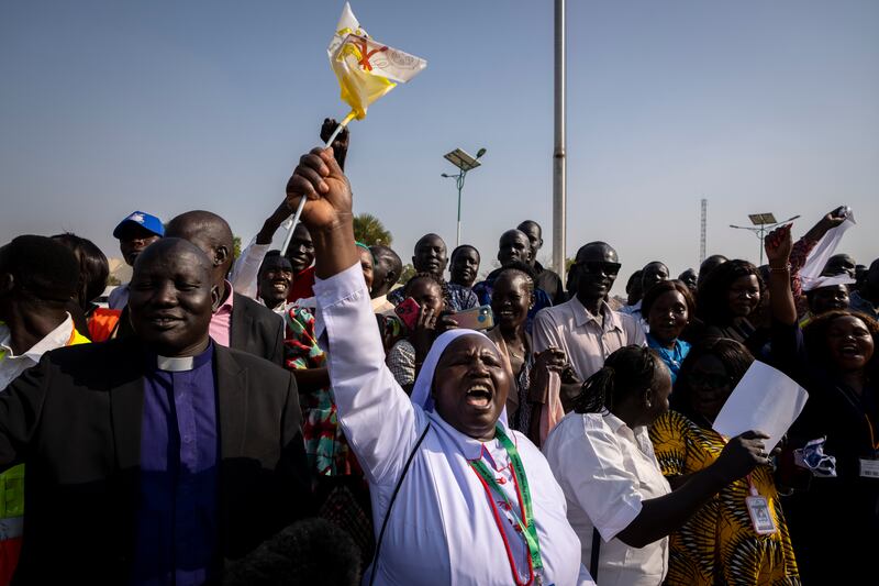 A nun in the crowd shouts that the country needs peace as Pope Francis prepares to leave in his vehicle from the airport. AP 