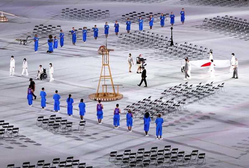 The Japanese national flag is carried ahead of the opening ceremony. Reuters