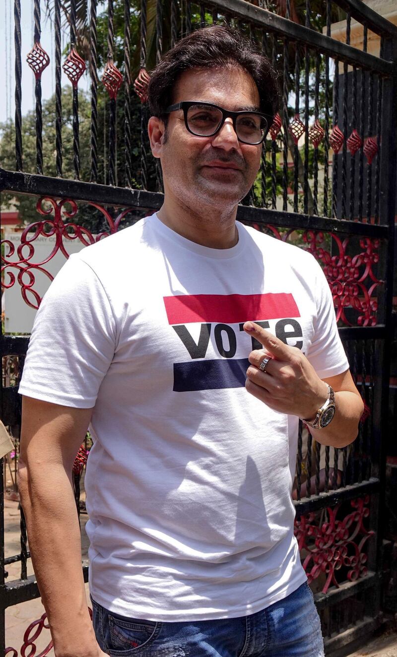 Bollywood actor and director Arbaaz Khan poses for photographs as he leaves a polling station after casting his vote in Mumbai on April 29, 2019. AFP