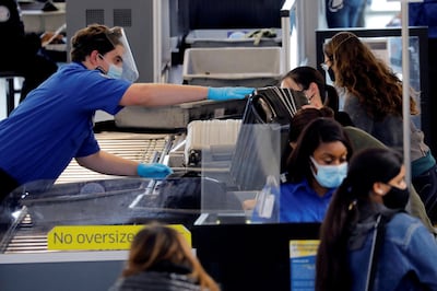 Most travellers still need to remove liquids and laptops from their bags in US airports. Reuters