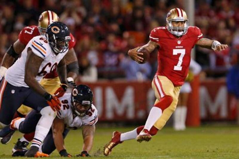 San Francisco 49ers' quarterback Colin Kaepernick avoids pressure from the Chicago Bears.