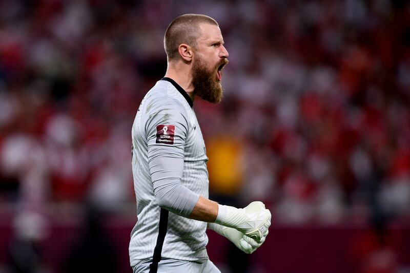 Andrew Redmayne of Australia reacts after saving a penalty during the shootout in the 2022 World Cup Intercontinental playoff against Peru at Ahmad bin Ali Stadium on June 13, 2022 in Doha, Qatar. Australia booked their place to the global finals by winning the shootout 5-4. Getty Images
