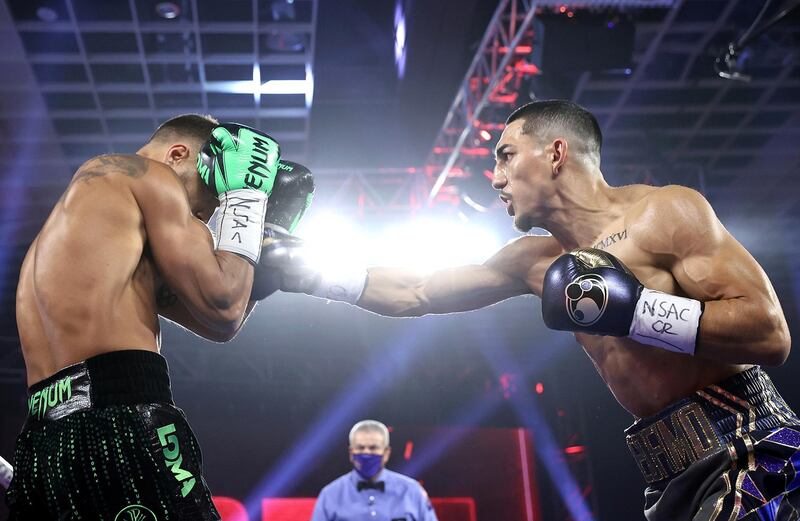 LAS VEGAS, NEVADA - OCTOBER 17: In this handout image provided by Top Rank, Teofimo Lopez Jr punches Vasiliy Lomachenko in their Lightweight World Title bout at MGM Grand Las Vegas Conference Center on October 17, 2020 in Las Vegas, Nevada. (Photo by Mikey Williams/Top Rank via Getty Images)