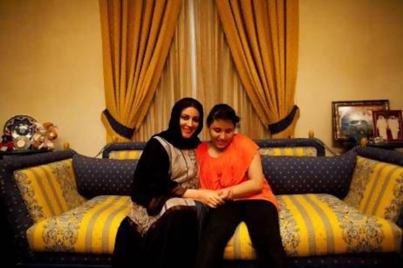 “I don’t feel embarrassment now when I go with her anywhere in Dubai, ” says Najla Hassan, mother of Roudha Hassan, 10, right, a girl with autism. Christopher Pike / The National