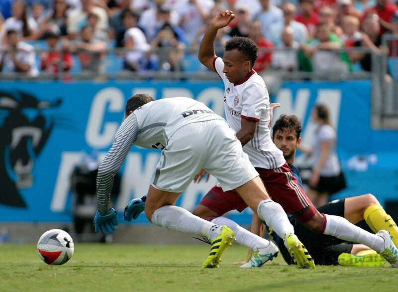 Julian Green of Bayern Munich battles Samir Handanovic and Andrea Ranocchia of Inter Milan in front of the net during an International Champions Cup match at Bank of America Stadium on July 30, 2016 in Charlotte, North Carolina. Grant Halverson / Getty Images / AFP