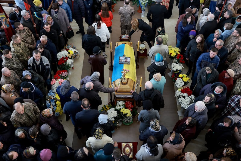 Mourners gather at the funeral of Ukrainian soldier Andriy Zagornyakon in Kamianka-Buzka. Getty Images