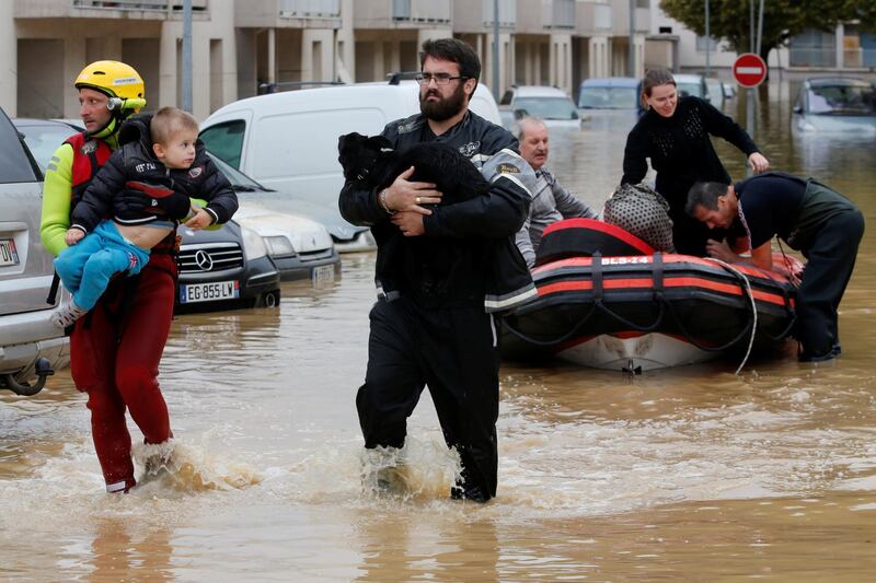 Emergency workers rescue residents from a neighborhood in Trebes after flash floods hit the southwestern Aude district of France. Reuters