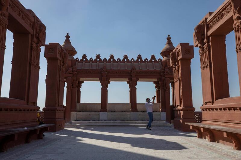 A man photographs the Baron Empain Palace, during the opening after its reconstruction in Heliopolis, Cairo, on June 30, 2020. AP