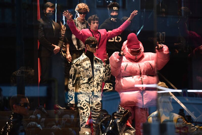 Dolce & Gabbana's Men's autumn/winter 2022/2023 fashion show was held behind a glass door. AFP